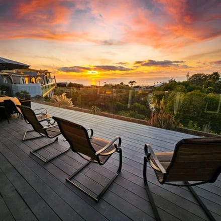 Sunset deck with lounge chairs overlooking the Pacific