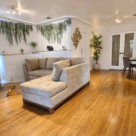 Little Italy 4BR living room with hardwood floors and open dining area